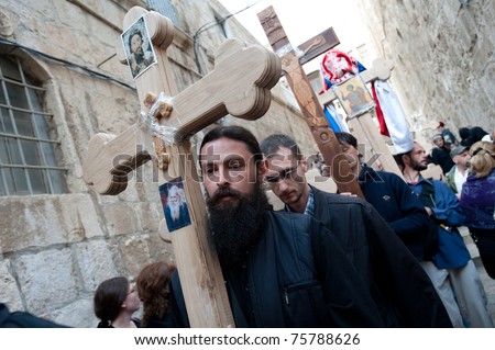 JERUSALEM - APRIL 22: Orthodox Christian pilgrims commemorate the path Jesus carried his cross on the day of his crucifixion along the Via Dolorosa in Jerusalem on Good Friday, April 22, 2011.