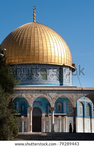 The Dome of the Rock rises above a Muslim woman on the Haram al-Sharif, also known as the Temple Mount, in the Old City of Jerusalem.