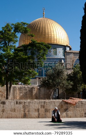 JERUSALEM - MAY 23: A Muslim man prays near the Dome of the Rock on the Haram al-Sharif, also known as the Temple Mount, in the Old City of Jerusalem on May 23, 2011.