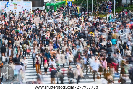 TOKYO CITY, JAPAN - 02 MAY 2013: Shibuya pedestrian crossing with crowd. This area is known as one of the fashion centers of Japan, particularly for young people, and as a major nightlife area
