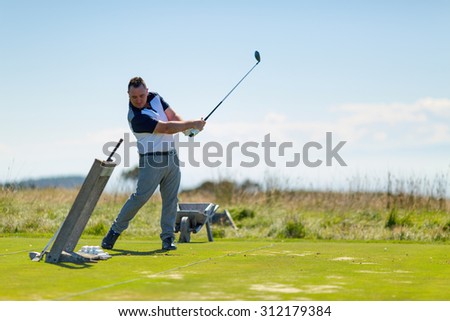 Golf player on the golf field. Cape Kidnappers golf court. New Zealand.