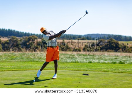 CAPE KIDNAPPERS GOLF CLUB, NEW ZEALAND - 02 FEBRUARY 2015: Golf player is practicing on the golf field. Cape Kidnappers golf court. New Zealand.