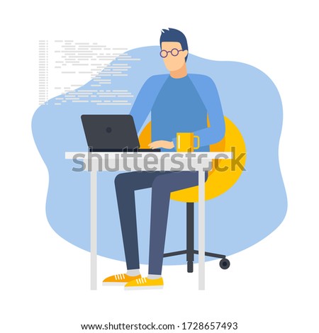 Young programmer using laptop and desktop computer at workplace. Work of a programmer. modern computer technology 