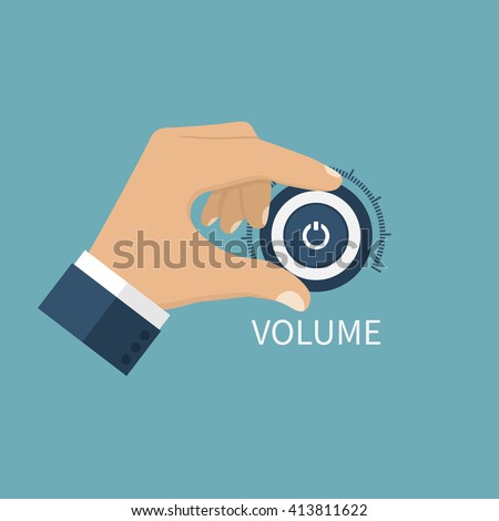 Adjusting volume. Hand on volume control button. Sound control knob. Turning.