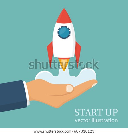 Start up concept. Businessman holds a flying rocket in hand, symbol of start of project's launch. Vector illustration cartoon flat design. Isolated on white background. Business metaphor. Photo stock © 