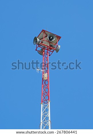 speakers tower among clear blue sky
