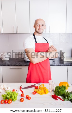Young Man Cooking. Healthy Food - Vegetable Salad. Diet. Dieting Concept. Healthy Lifestyle.