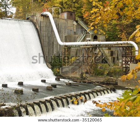 Gorge Metropolitan Park Dam and idled hydro-power plant on the Cuyahoga River outside Akron, Ohio. Surrounded by trees in full fall colors fall