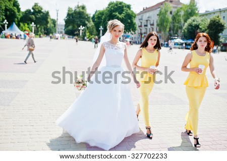 bridesmaid at yellow dresses walking and bride