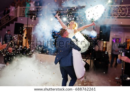 Similar – Image, Stock Photo Couple on their wedding apparel walking by the street