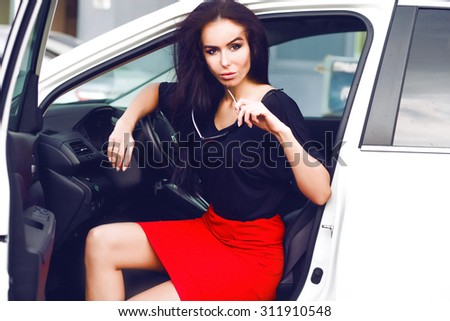 Amazing close-up Portrait sensual luxury woman on meeting,Business woman,luxury accessories,natural makeup sitting in luxury white car.Attractive woman wear long skirt,hat,elegant style,fashionable