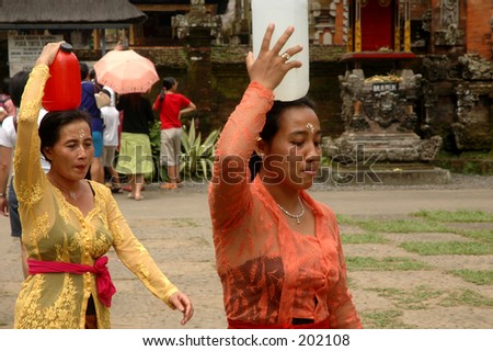 Women carrying holy water, Bali, Indonesia