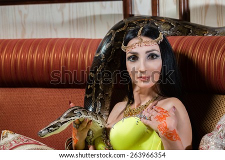 Caucasian woman with the snake traditional indian dress.