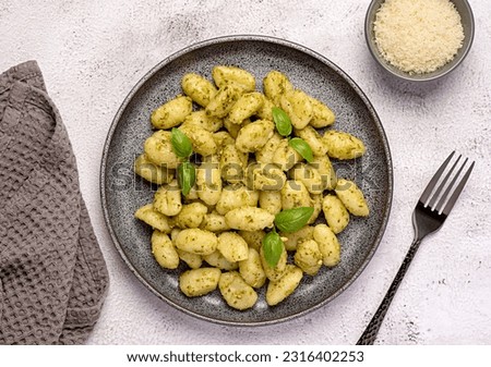 Similar – Image, Stock Photo Fresh cooked food in baking dish with various ingredients. Kitchen equipment. Dark concrete background.Flat lay. Top view