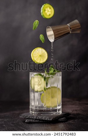 Similar – Image, Stock Photo Lemonade glass with cucumber and lime. Summer cocktail