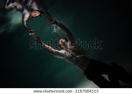 Similar – Image, Stock Photo Man swimming under water in sea