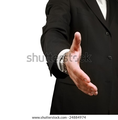 A businessman shaking hands to seal a deal. Shallow depth of field, focus on finger-tips.