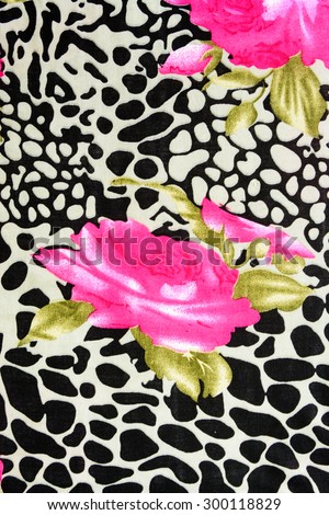 Texture fabric of leopard and rose for background