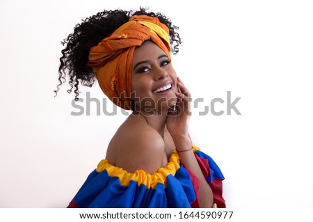 Beautiful brunette Colombian woman with typical costume smiling in white background Foto stock © 