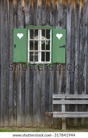bench and window of an old farmhouse in styria, austria
