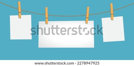 white color note paper card hanging with wooden clip or clothespin on rope  isolated on blue background. 3D illustration, vector