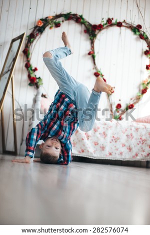 boy dancing break dance and stand on his head