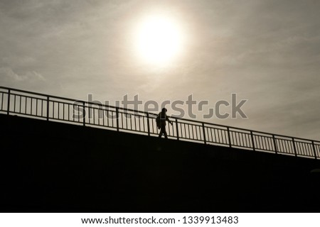 Similar – Image, Stock Photo Silhouette of bridge, man and ship in the morning light