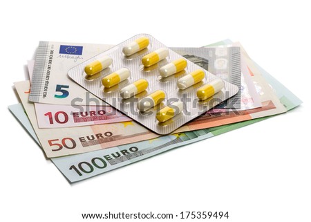 Medicines and euro banknotes isolated on white background