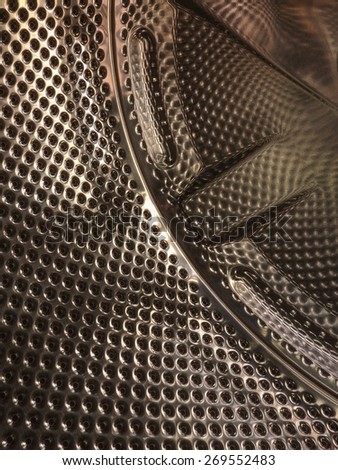 Abstract metal pattern from washing, laundry machine drum, interior.