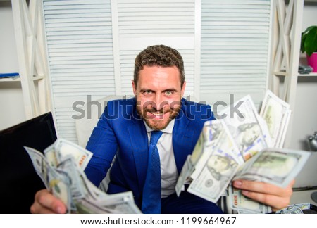 Earn money easy business tips. Man cheerful happy businessman with pile dollar banknotes. Profit and richness concept. Che k out my profit this month. Businessman formal suit hold cash dollars hands. Stock foto © 