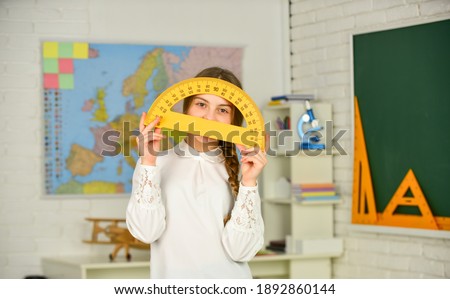 Science and Technology. Mathematics matters. Small child holding ruler for mathematics lesson. Cute little schoolgirl with geometrical tool for mathematics. Elementary school mathematics or maths.