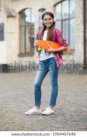 Similar – Image, Stock Photo Trendy skater keeping balance standing on skateboard