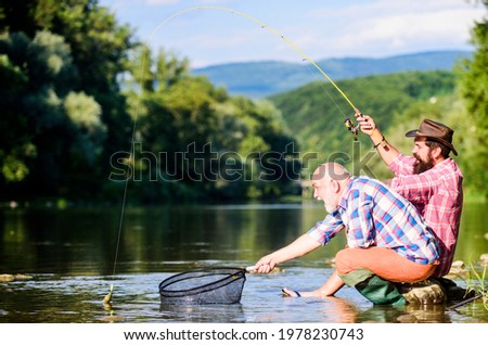 Similar – Image, Stock Photo two fishermen in a boat with reflection in a still river water at twilight on autumn landscape.