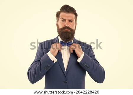 Man in suit fixing bow tie. Portrait of handsome man in suit. He will melt your heart. man in tuxedo. The Best Interview Attire for Men. Atelier tailoring mens suits. man grooming in morning