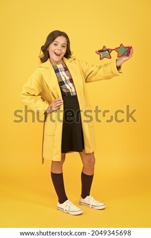 Fame and popularity. Popular schoolgirl. Carnival costume famous celebrity. Cheerful girl wear eyeglasses. Cool kid celebrity. Dreaming about fame. Become popular. Celebrity child. Star concept