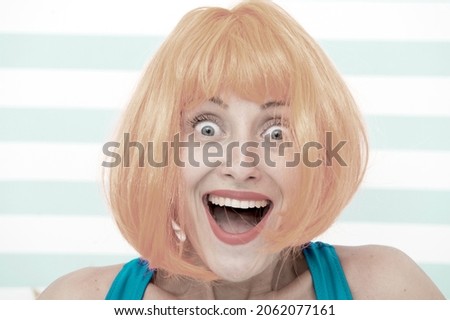 happy crazy girl with omg or wow facial expression. happy girl with crazy look. wow. surprised happy girl with orange hair. crazy look of girl saying omg. what a surprise. feeling and emotions