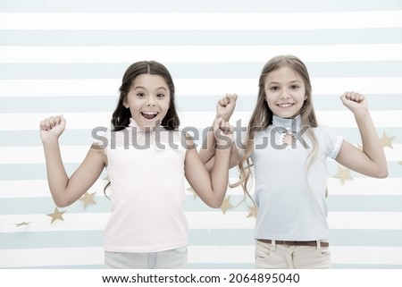 Thrilled moments together. Kids schoolgirls preteens happy together. Girls smiling happy faces excited expression stand striped background. Girls children best friends thrilled about surprising news ストックフォト © 