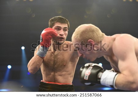 Kyiv, UKRAINE - December 13, 2014 : An unidentified boxers in the ring during fight for ranking points in the Palace of sport, Kiev, Ukraine