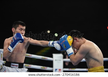 Kyiv, UKRAINE - April 17, 2015 :  DUSMATOV Hasanboy (UA) in the ring during boxing fight Ukraine Otamans vs China Dragons in Palace of Sport in Kiev, Ukraine