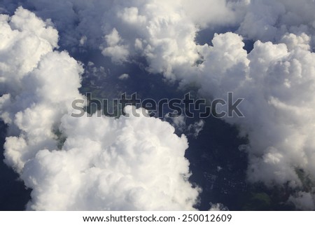 Beautiful clouds over the earth. The view from the aircraft.