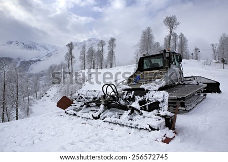 Sochi, Russia - February 10, 2015: Plow snow removal equipment in the mountains of Roza Khutor Resort in Sochi.