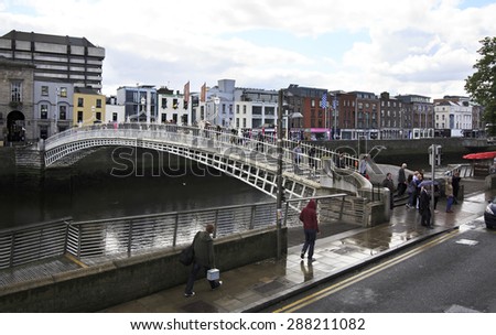 Dublin, Ireland - August 19, 2014: River Liffey and the Ha Penny Bridge