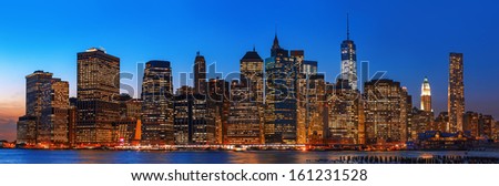 Manhattan. Night New York City skyline panorama with lights and reflections.