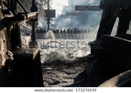 KIEV, UKRAINE - JAN 26, 2014: Mass anti-government protests in the center of Kiev. Government troops guarding the government district