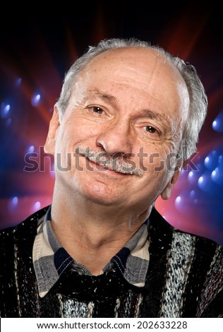 Portrait of happy senior man on a colorful spotted background