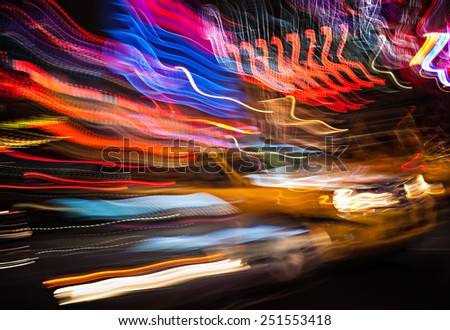 Taxi at night in New York City. Illumination and night lights of New York City. Intentional motion blur