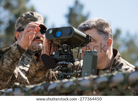 CHERNIHIV REG, UKRAINE - May. 11, 2015: President of Ukraine Petro Poroshenko, examines the latest weapons in the Ukrainian army training center of the Land Forces of the Armed Forces \