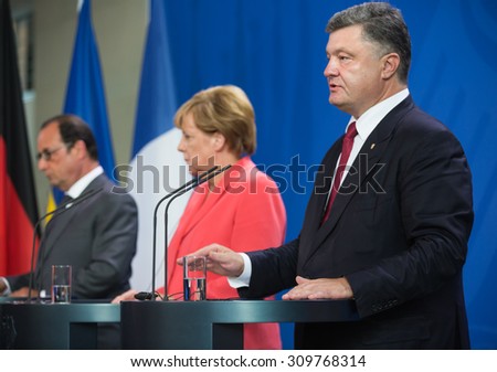 BERLIN, GERMANY - Aug 24, 2015: French President Francois Hollande, Chancellor of Federal Republic of Germany Angela Merkel and President of Ukraine Petro Poroshenko during a joint briefing in Berlin