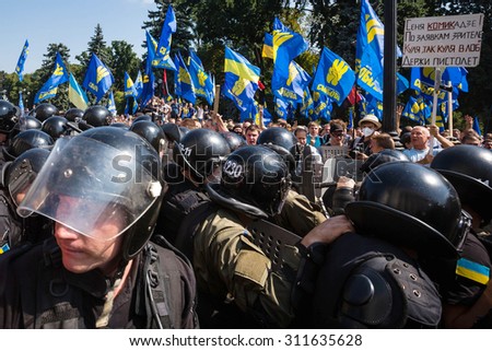 KIEV, UKRAINE - Aug 31, 2015: Clashes between protesters against amending the Constitution and law enforcers. On the poster - \
