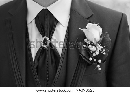 closeup shot of groom suit with buttonhole
